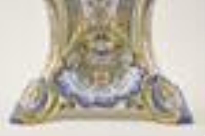 An extremely large and colorful French faience mantel clock