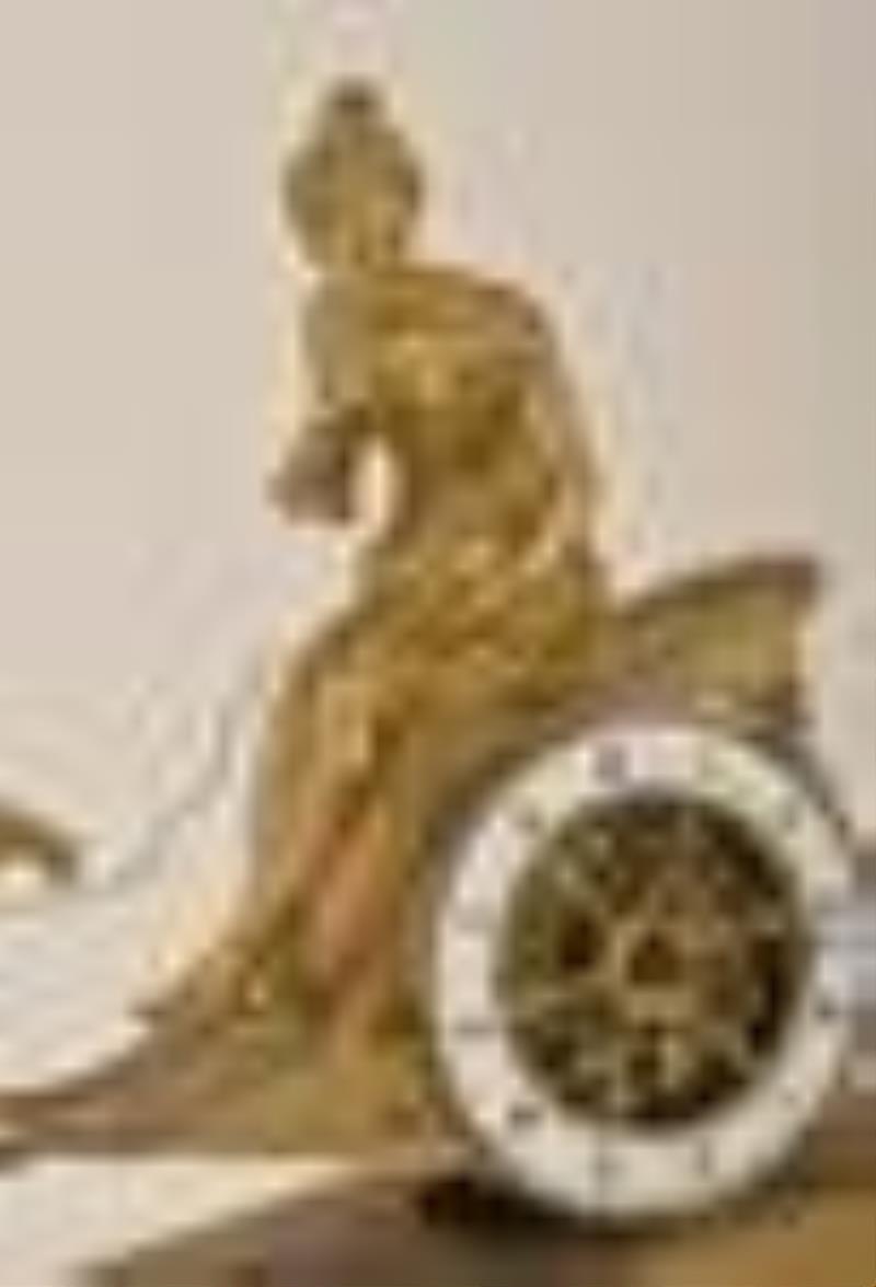 An early 19th century French figural mantel clock featuring Aphrodite in her chariot
