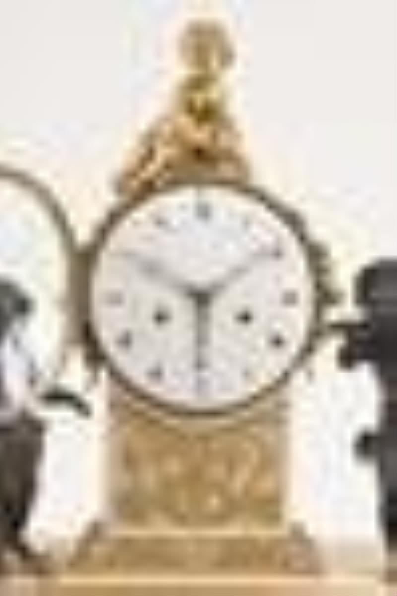 A late 18th century French bronze and marble figural mantel clock
