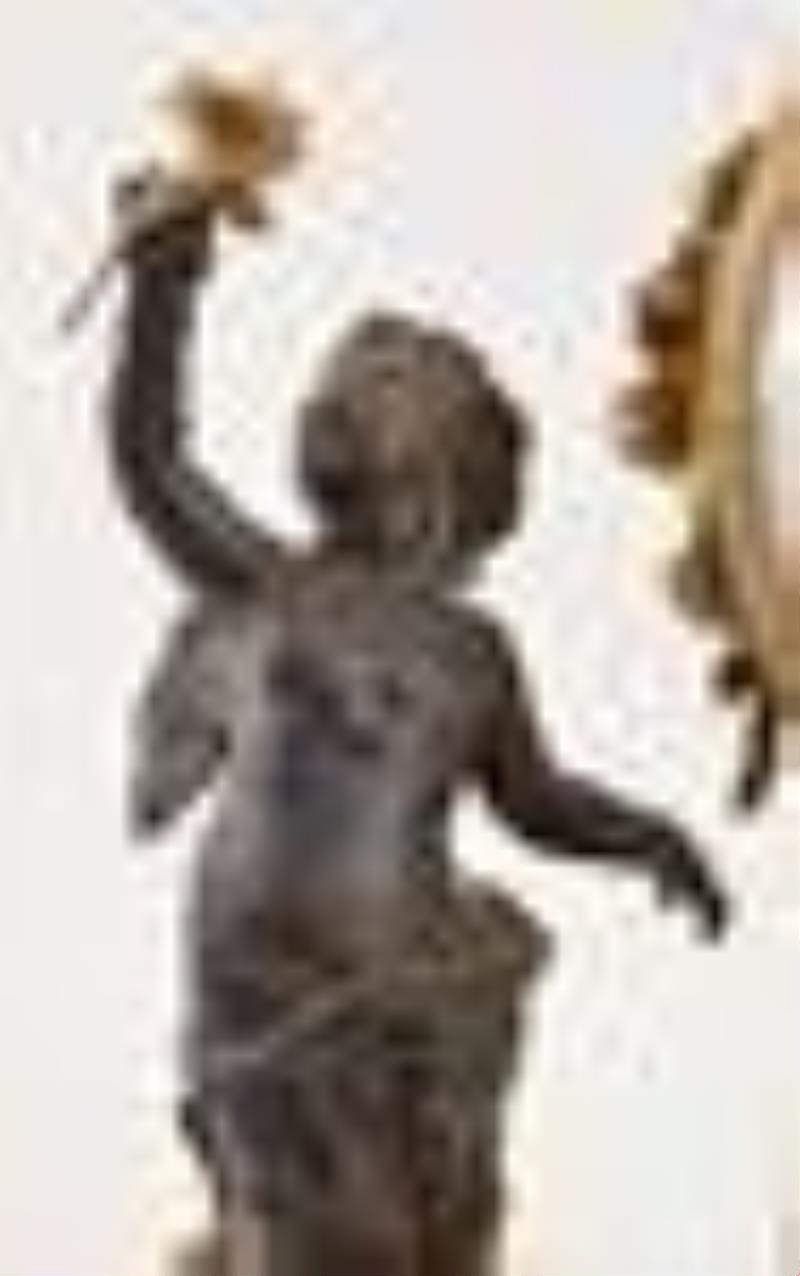 A late 18th century French bronze and marble figural mantel clock