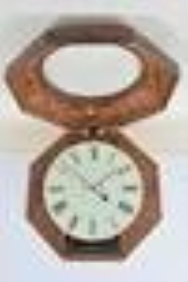 Atkins, Whiting & Co., ogee octagon wall clock with wagon spring movement.