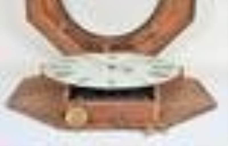 Atkins, Whiting & Co., ogee octagon wall clock with wagon spring movement.