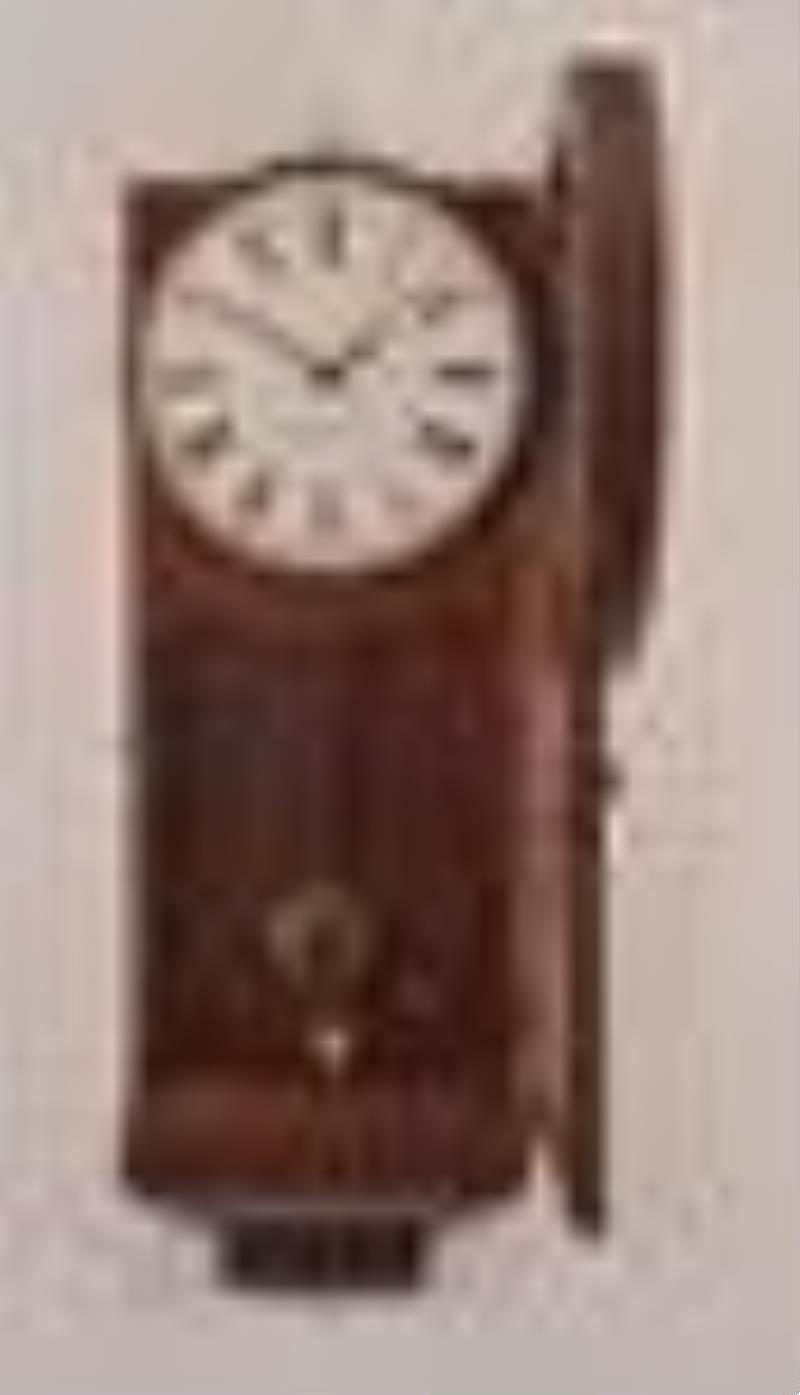 An Unusal Boston Clock Co. Hanging Clock with Carved Bezel and Art Glass Tablet