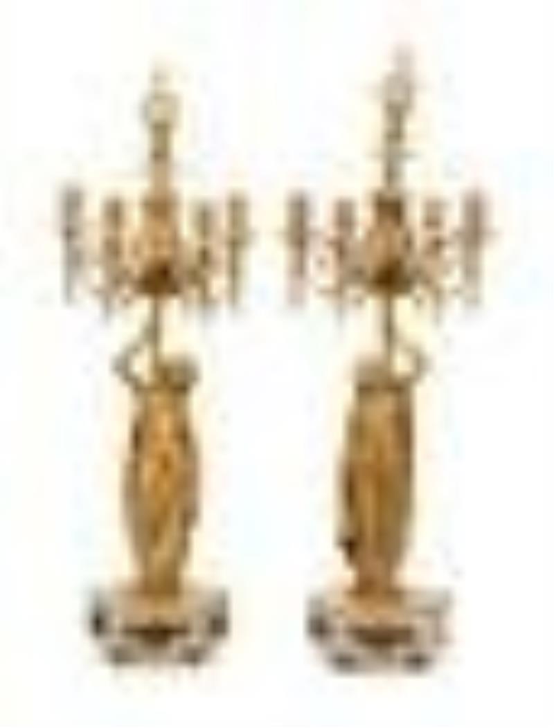 A Louis XVI Style Gilt Bronze and Marble Figural Clock Garniture