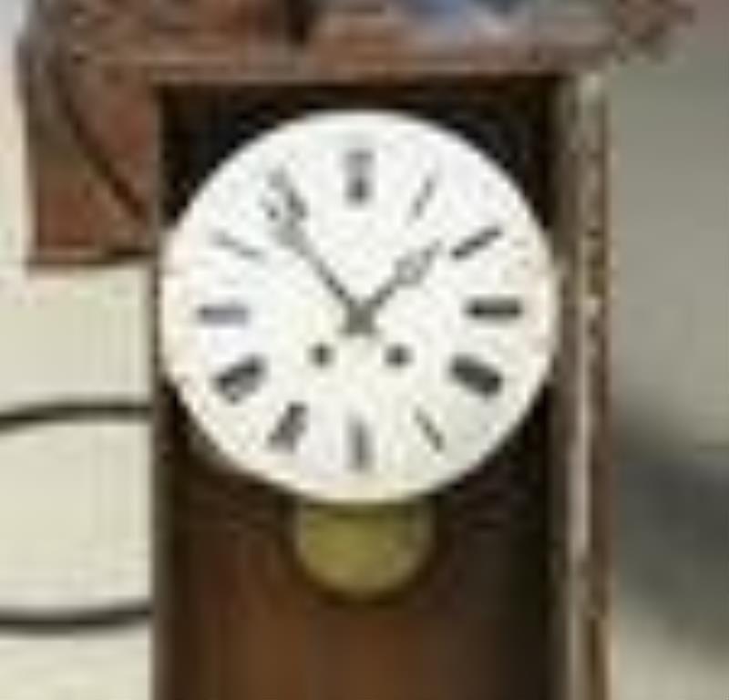 Carved oak Continental shelf clock