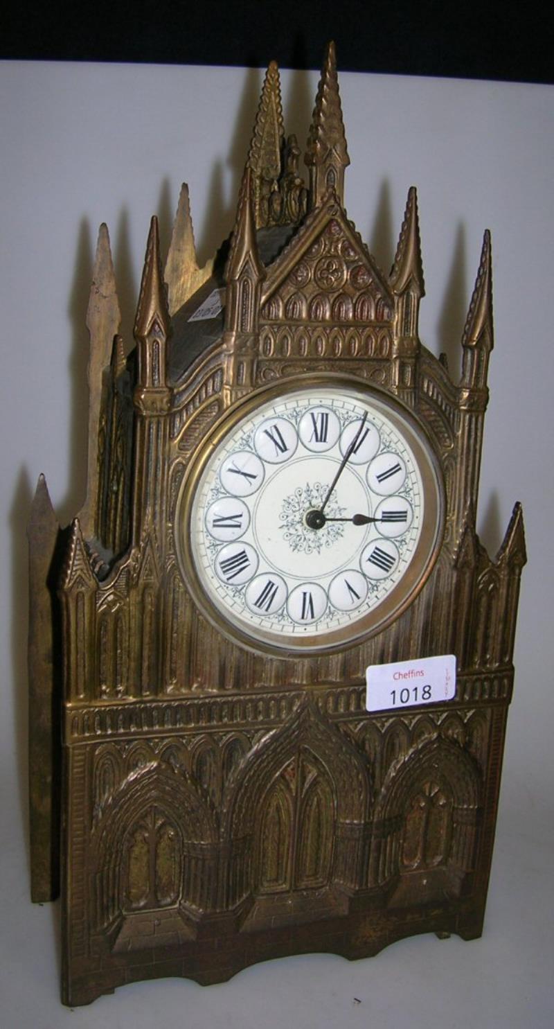 A BRASS CATHEDRAL CASE MANTEL CLOCK