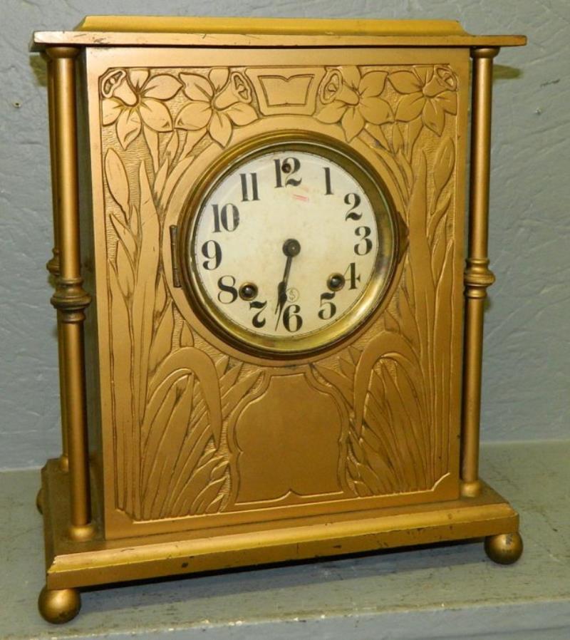 Ansonia metal case gold painted shelf clock.