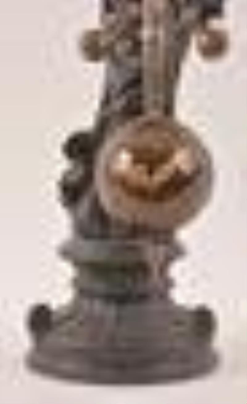 A 20th century French style figural clock with torsion pendulum