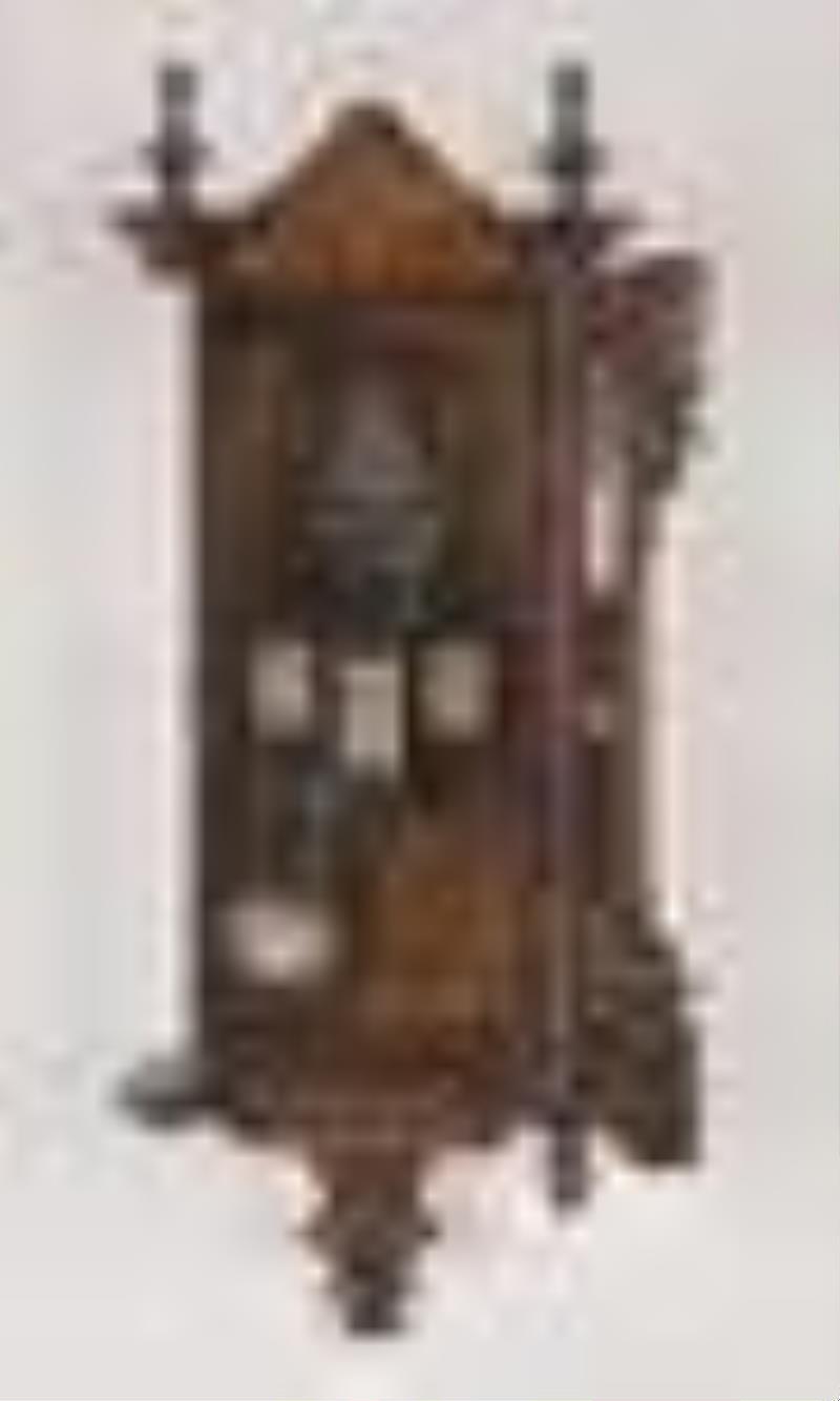 A late 19th century German hanging calendar clock