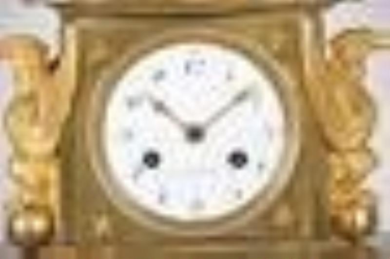 An attractive French Empire gilt bronze figural mantel clock
