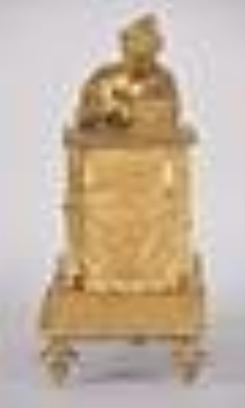 A French Empire gilt bronze figural mantel clock