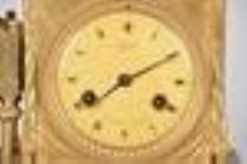 A French Empire gilt bronze figural mantel clock