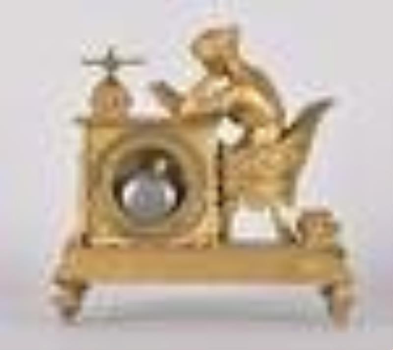 A French Empire gilt bronze figural mantel clock