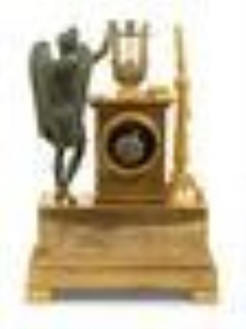 An Empire Gilt and Patinated Bronze Figural Mantel Clock