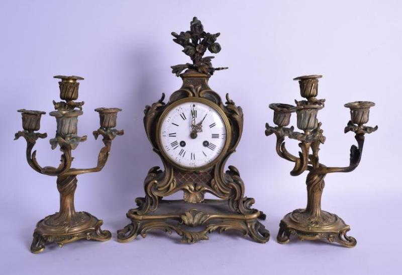 A MID 19TH CENTURY FRENCH GILT BRONZE CLOCK GARNITURE