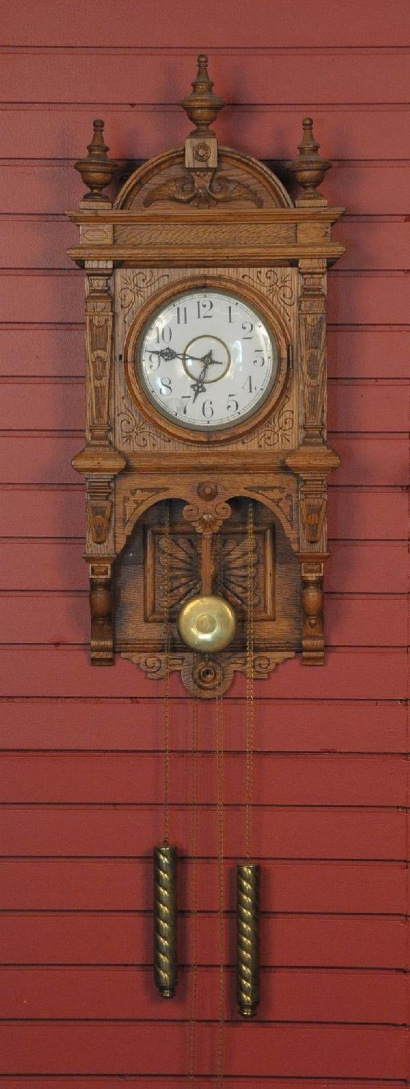 A WATERBURY STUDY NO. 4 ORNATE OAK WALL CLOCK