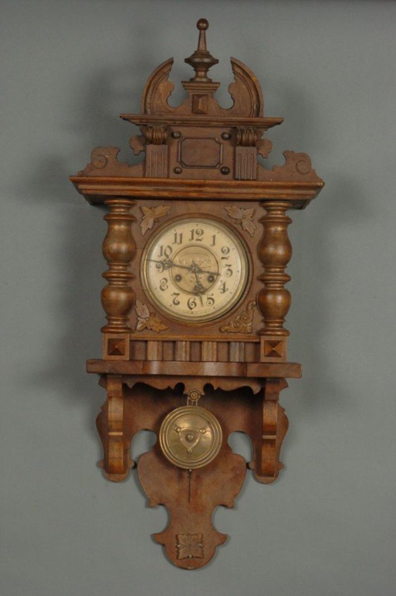 A GERMAN OPEN WAG WALL CLOCK