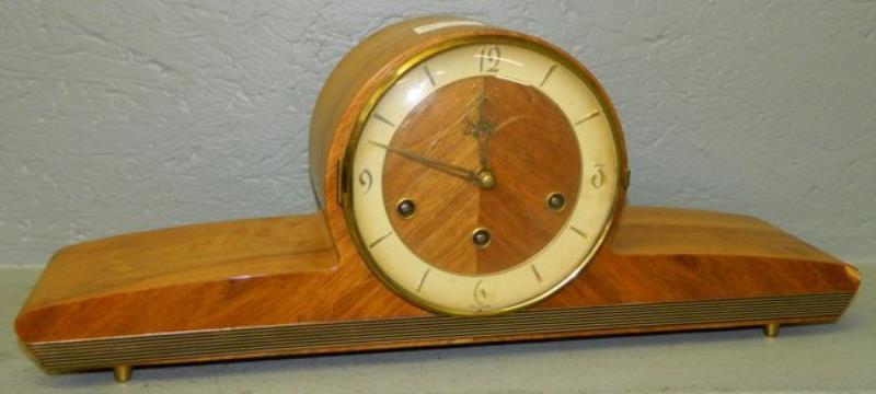 8 day clock w/brass numerals & modern case.