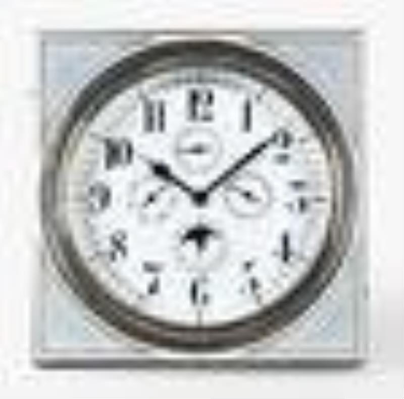 An early 20th century desk clock with triple calendar moon phase and guilloche enamel case