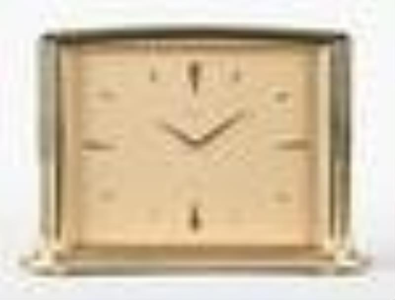 A good mid 20th century art deco style desk clock signed Gubelin