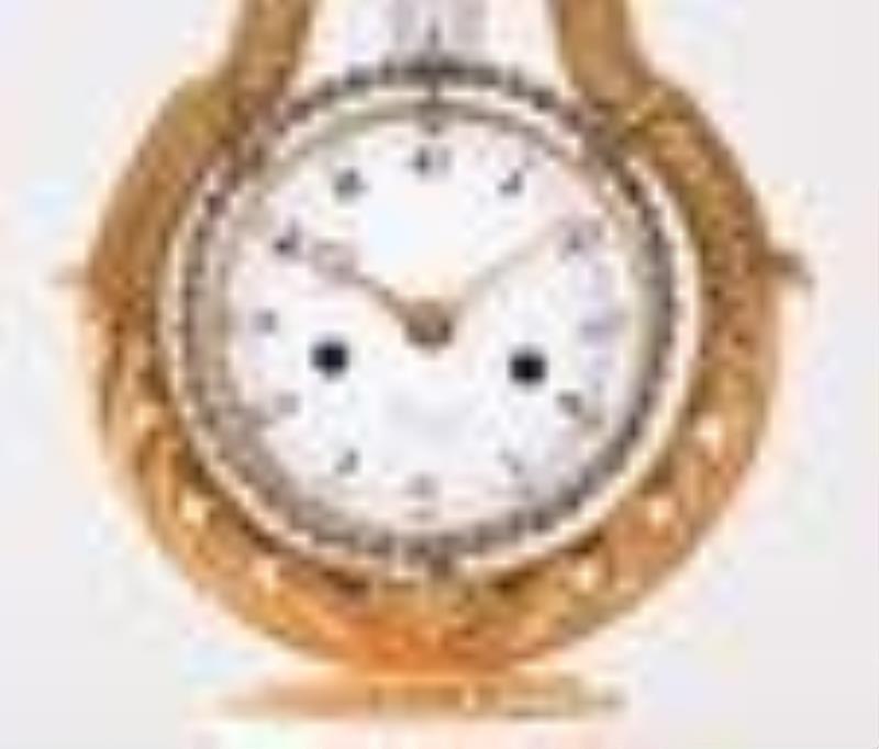 A late 18th century French lyre form mystery clock signed Cronier