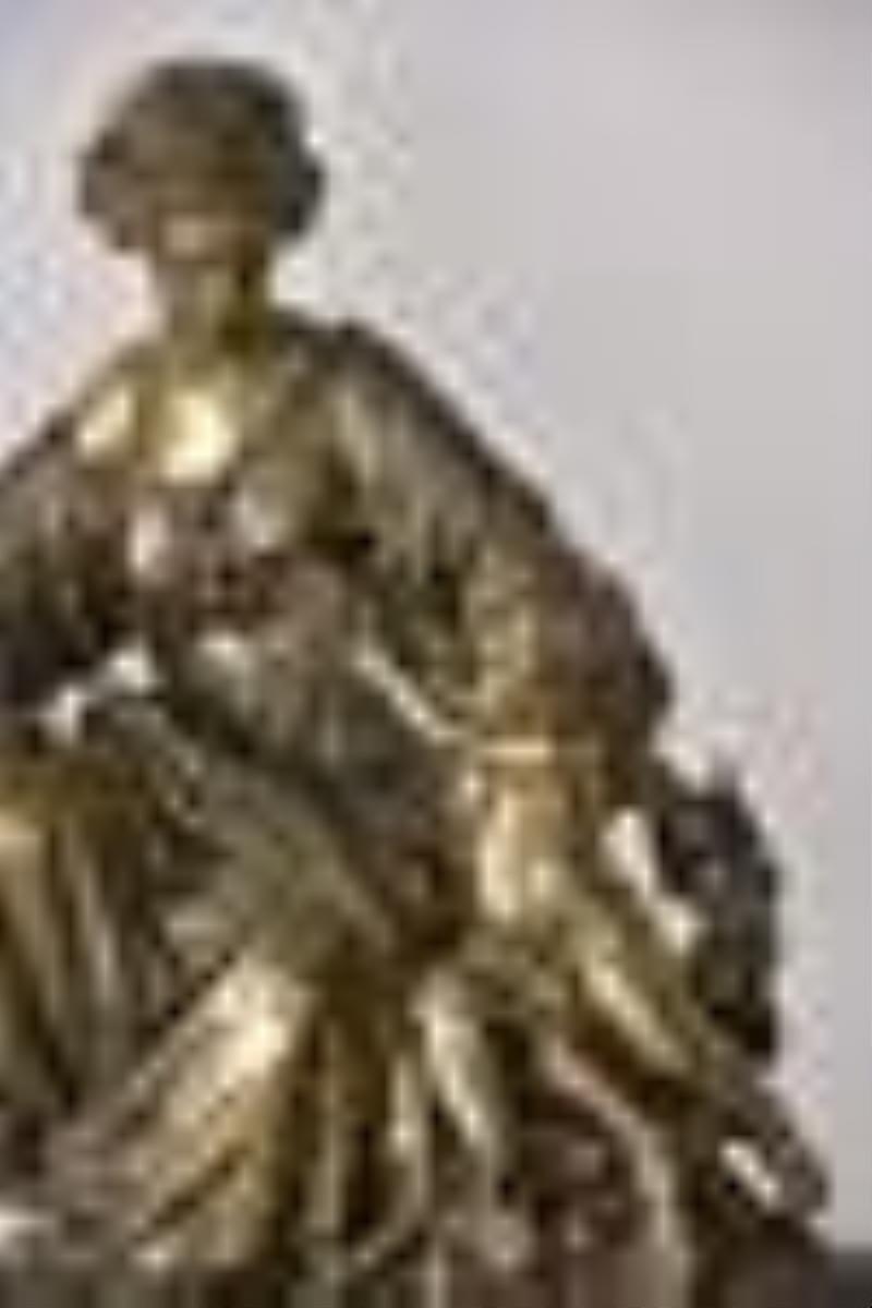 A large and impressive French figural mantel clock