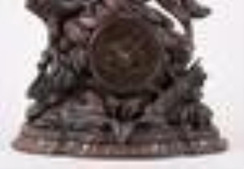 A good turn of the 20th century carved figural Black Forest clock with St. Bernard