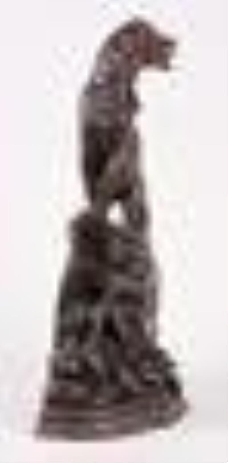 A good turn of the 20th century carved figural Black Forest clock with St. Bernard