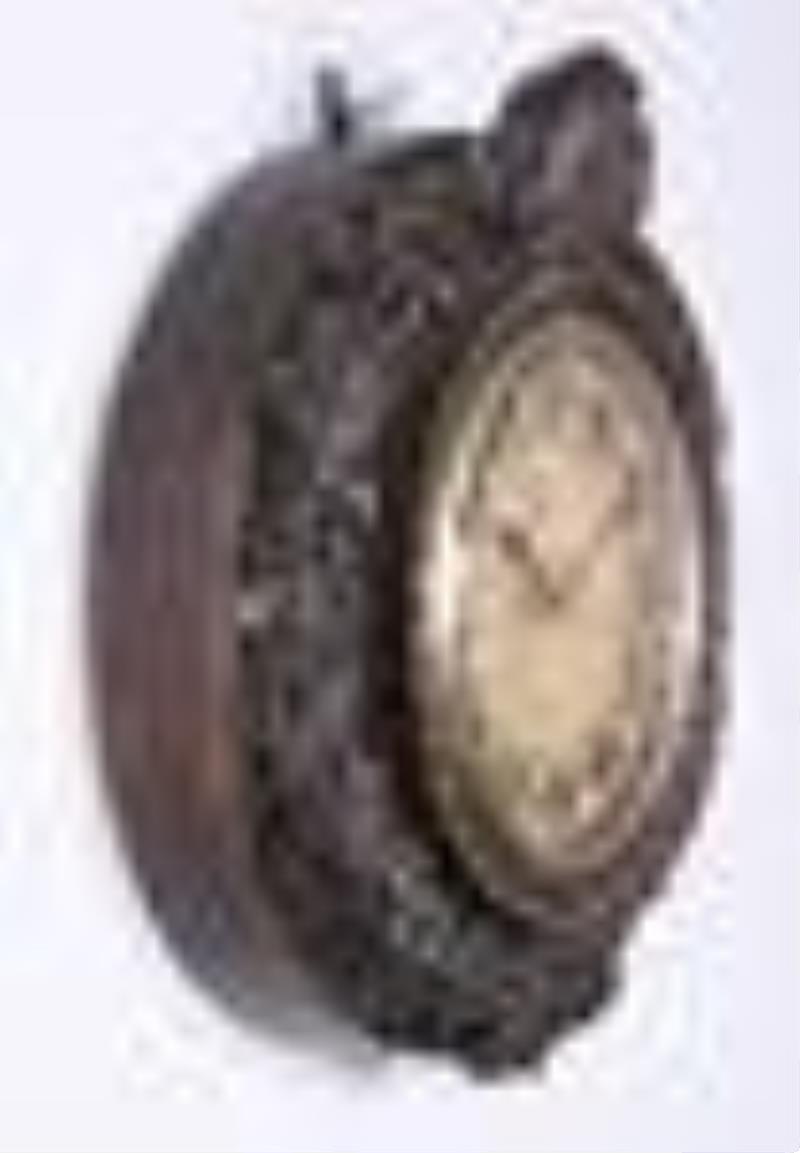 A large and interesting mid 19th century English fusee dial clock with carved case