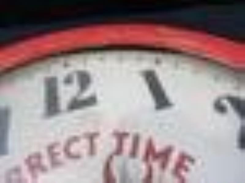 Early wood framed Monark Battery clock