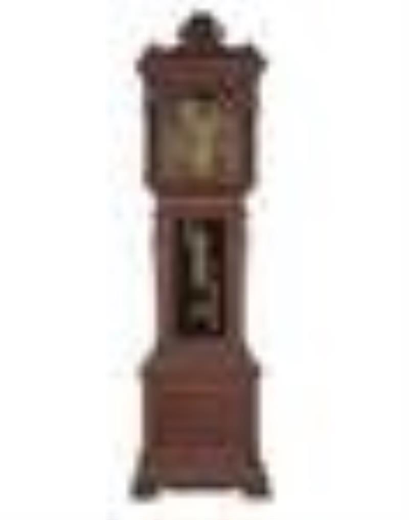 A Renaissance Revival Carved Walnut Tall Case Clock