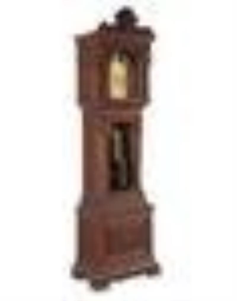 A Renaissance Revival Carved Walnut Tall Case Clock