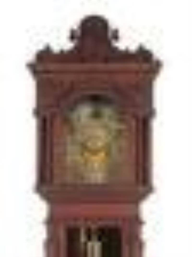 A Renaissance Revival Carved Walnut Tall Case Clock