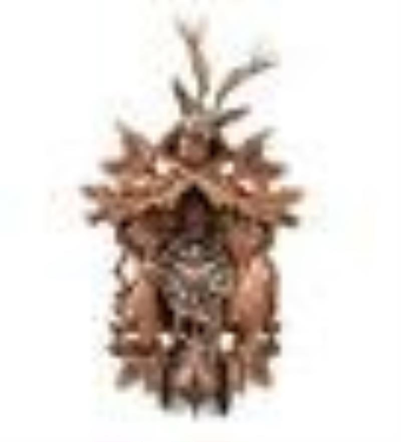A Black Forest Style Carved Walnut Cuckoo Clock