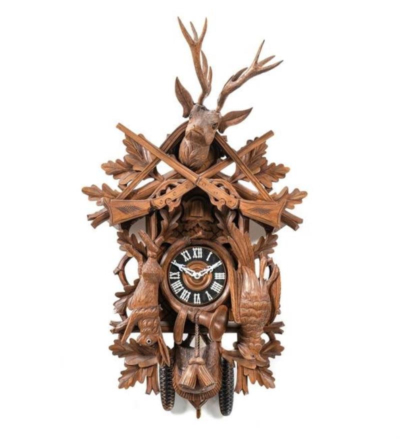 A Black Forest Style Carved Walnut Cuckoo Clock