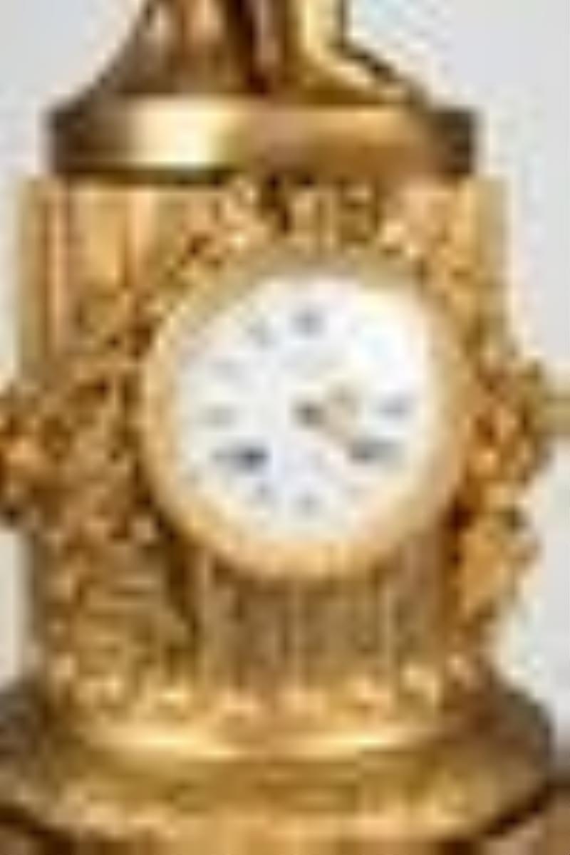 French Gilt Bronze and Rouge Marble Figural Clock