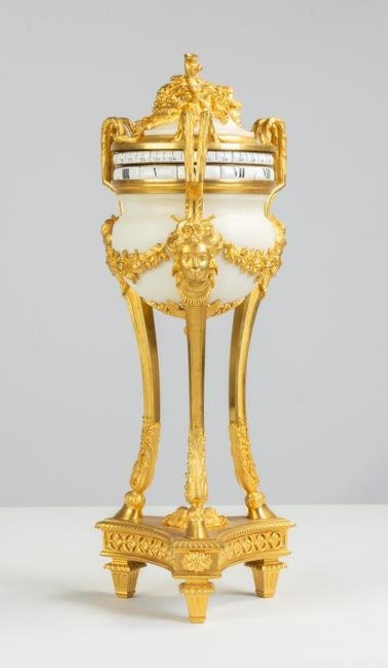 French Louis XVI Style Gilt Bronze and Marble Cercles Tourants' Striking Mantel Clock