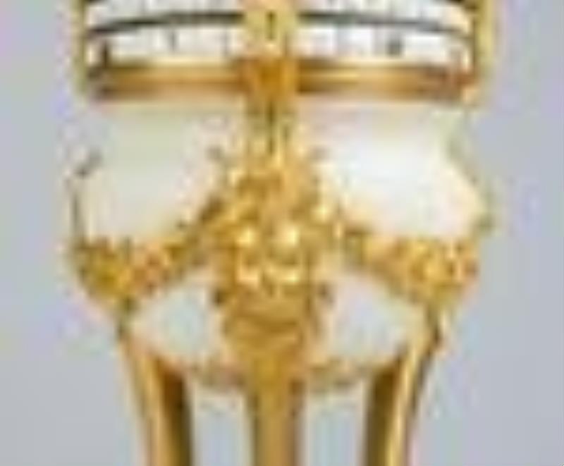 French Louis XVI Style Gilt Bronze and Marble Cercles Tourants' Striking Mantel Clock