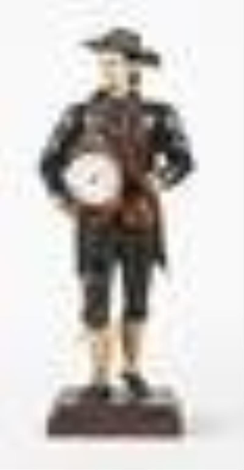 A good mid 19th century Black Forest sheet iron Uhrentrager or clock peddler figure