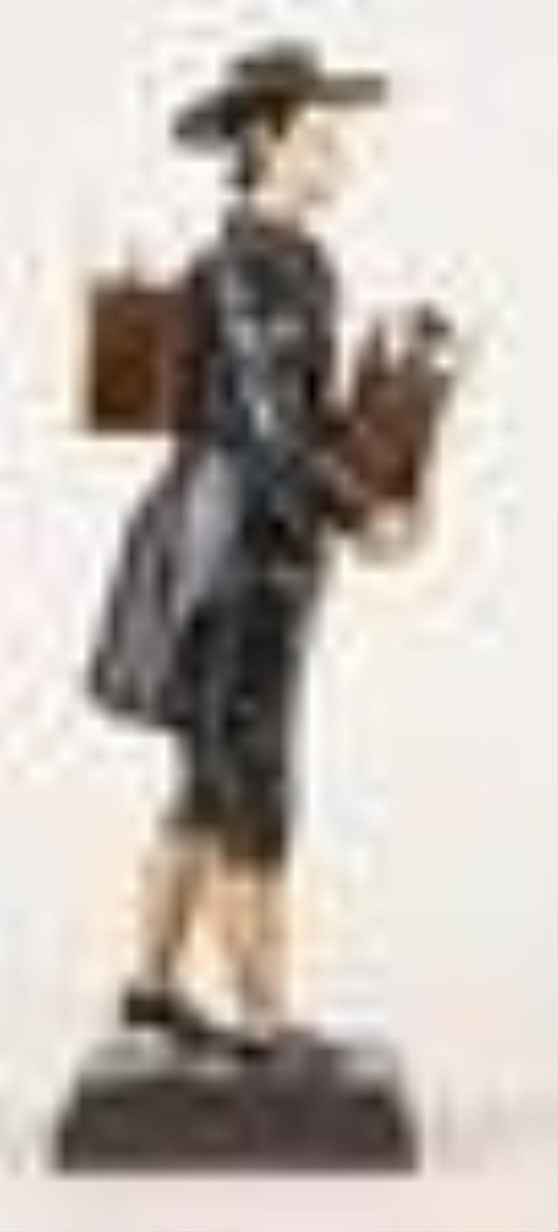 A good mid 19th century Black Forest sheet iron Uhrentrager or clock peddler figure