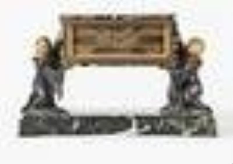 An interesting early 20th century French figural desk clock for Ovington New York