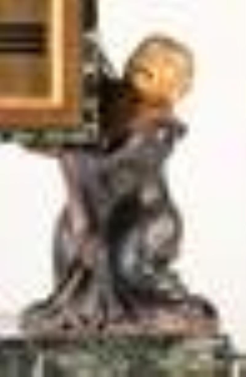 An interesting early 20th century French figural desk clock for Ovington New York