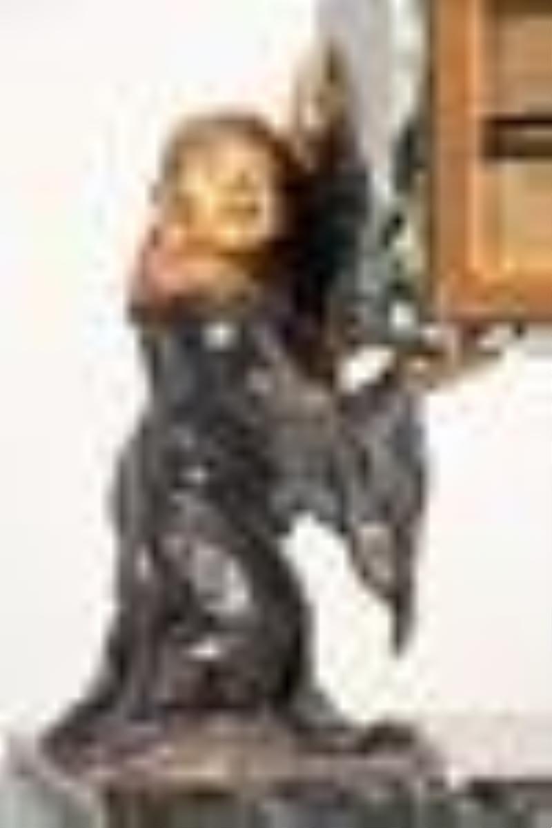 An interesting early 20th century French figural desk clock for Ovington New York