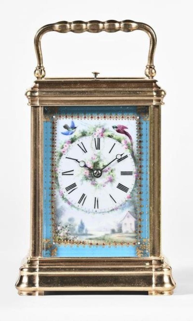 A very attractive 19th century French carriage clock with polychrome porcelain panels