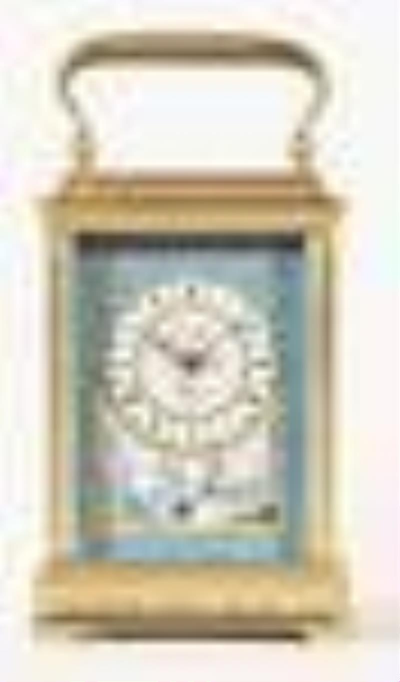 A good later 19th century French striking carriage clock with polychrome porcelain panels