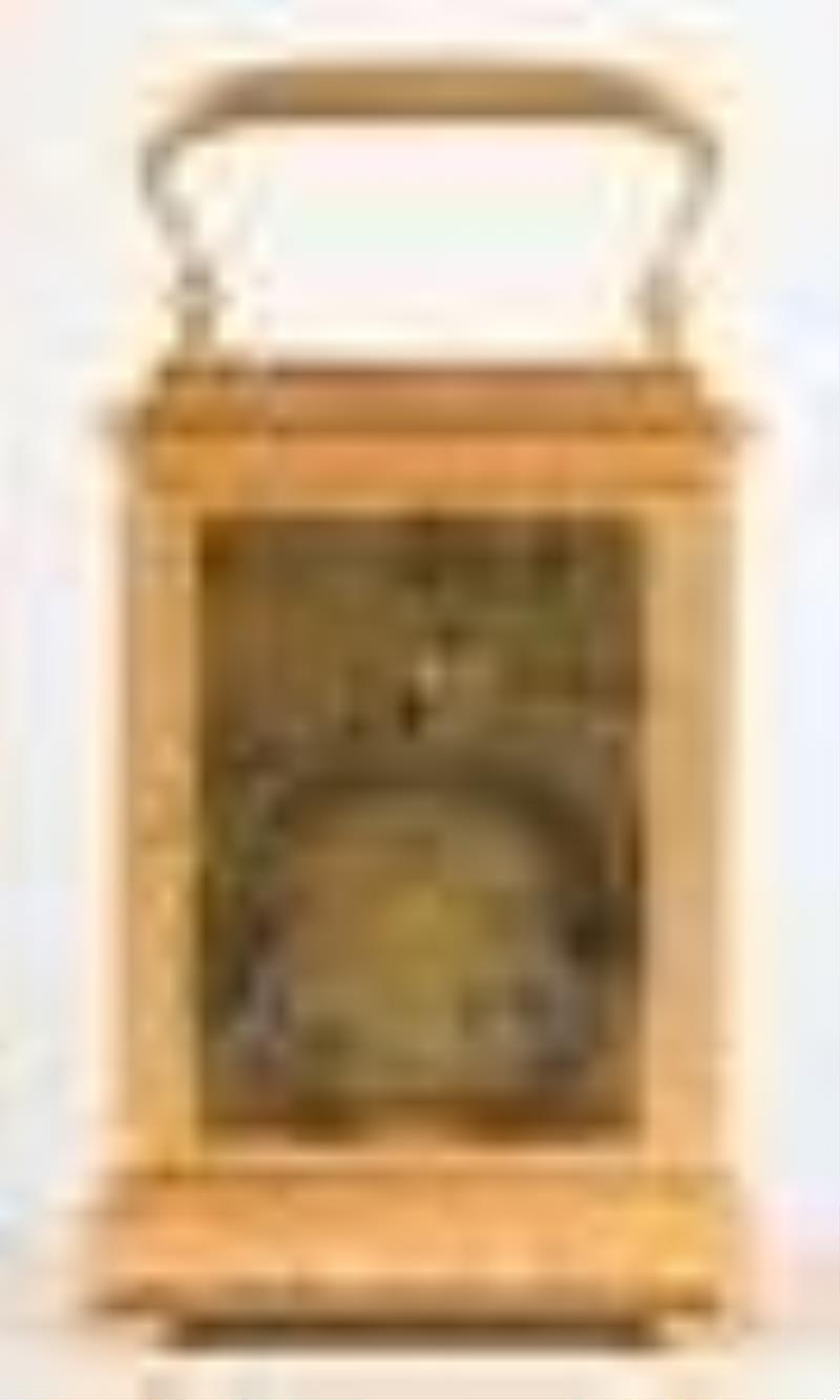 A good later 19th century French striking carriage clock with polychrome porcelain panels