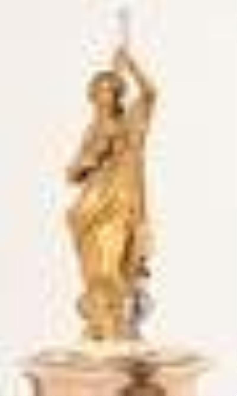 A late 19th century French figural mantel clock with conical pendulum