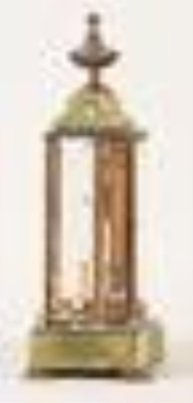 A decorative early 20th century 400 day mantel clock with champleve enamel ornament