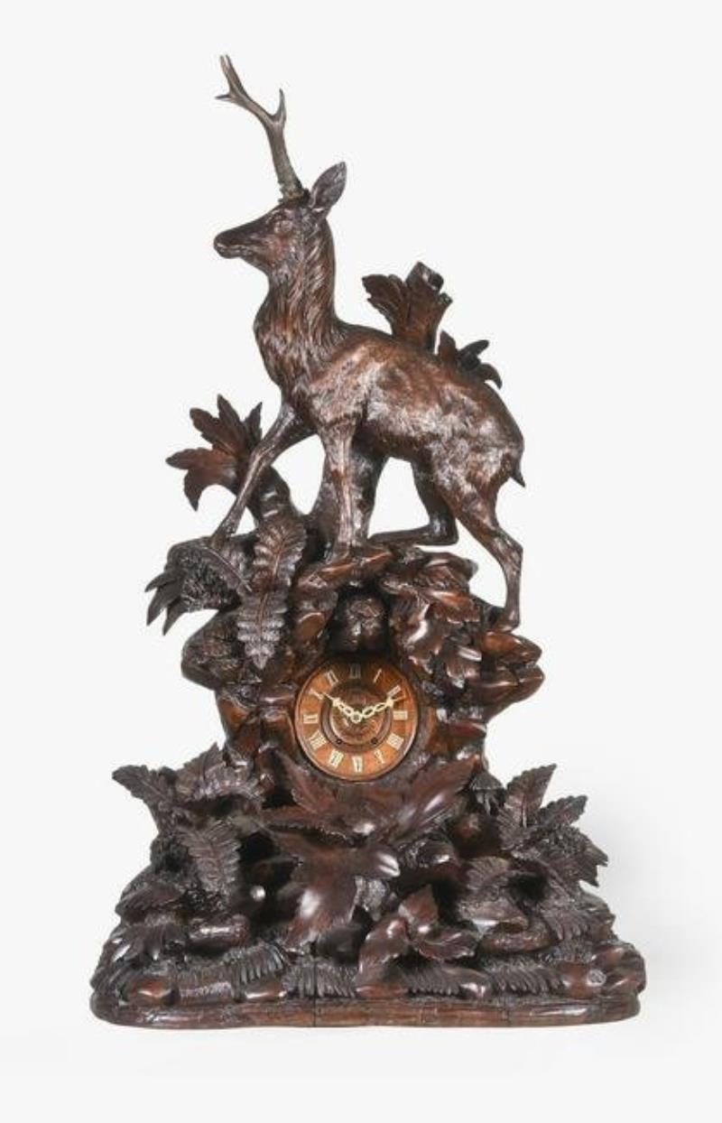 Black Forest monumental hand carved walnut mantel clock with stag in forest setting