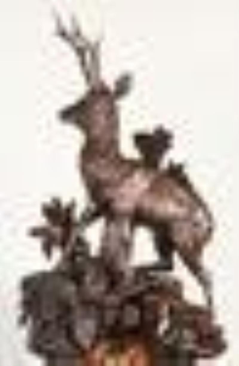 Black Forest monumental hand carved walnut mantel clock with stag in forest setting